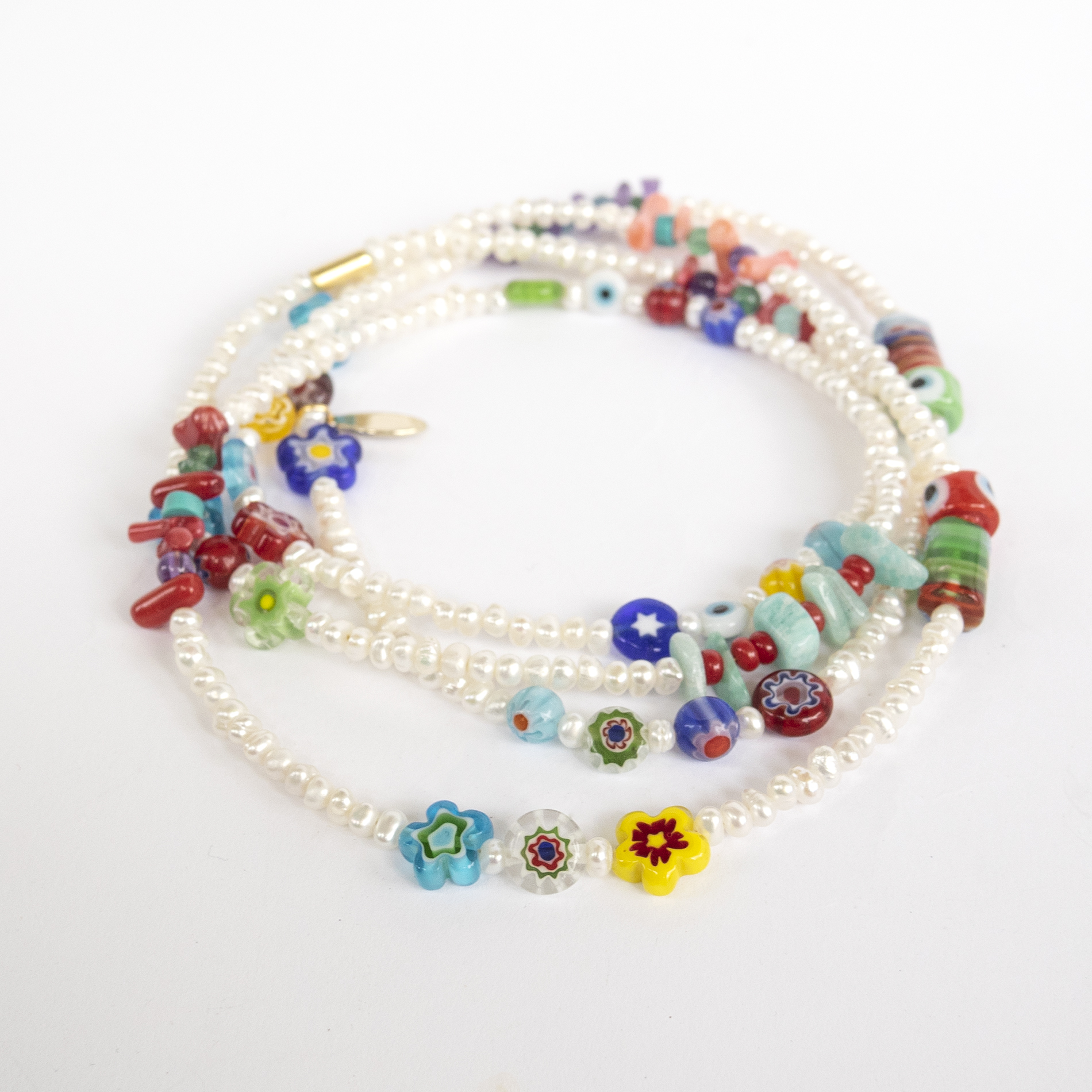 Necklace with fresh water pearls, millefiori beads, corals & semi-precious stones.